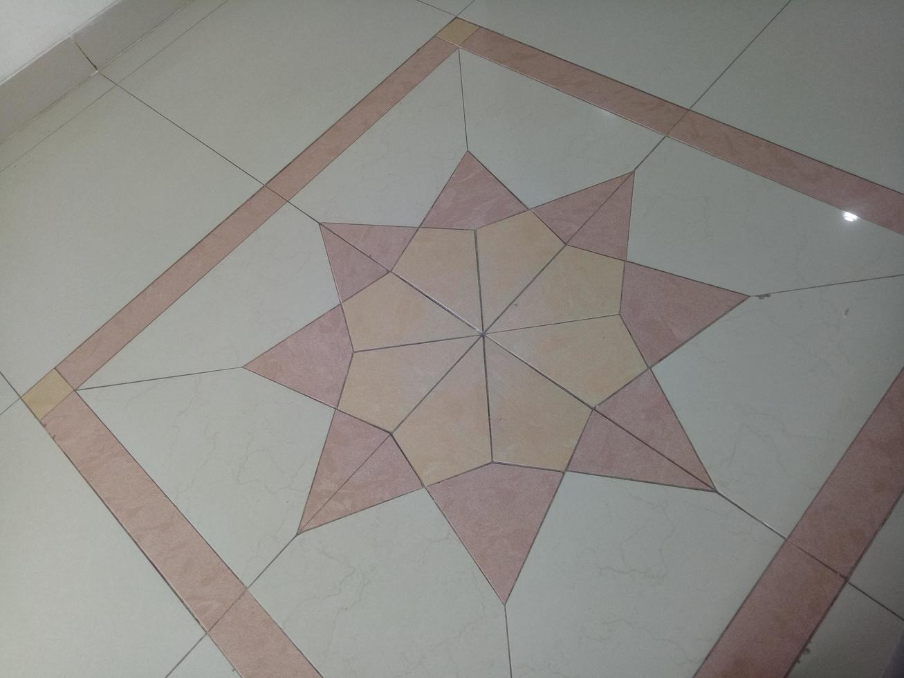 light brown tiled floor with star decoration photo