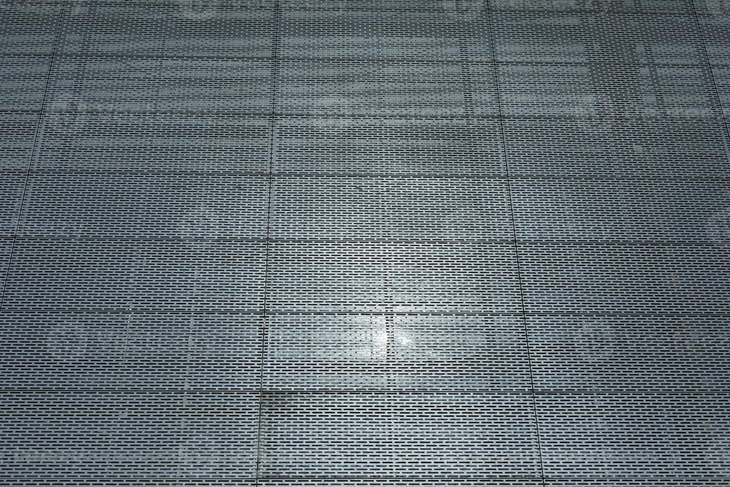 Steel wall of building. Grille on wall. Office building. photo