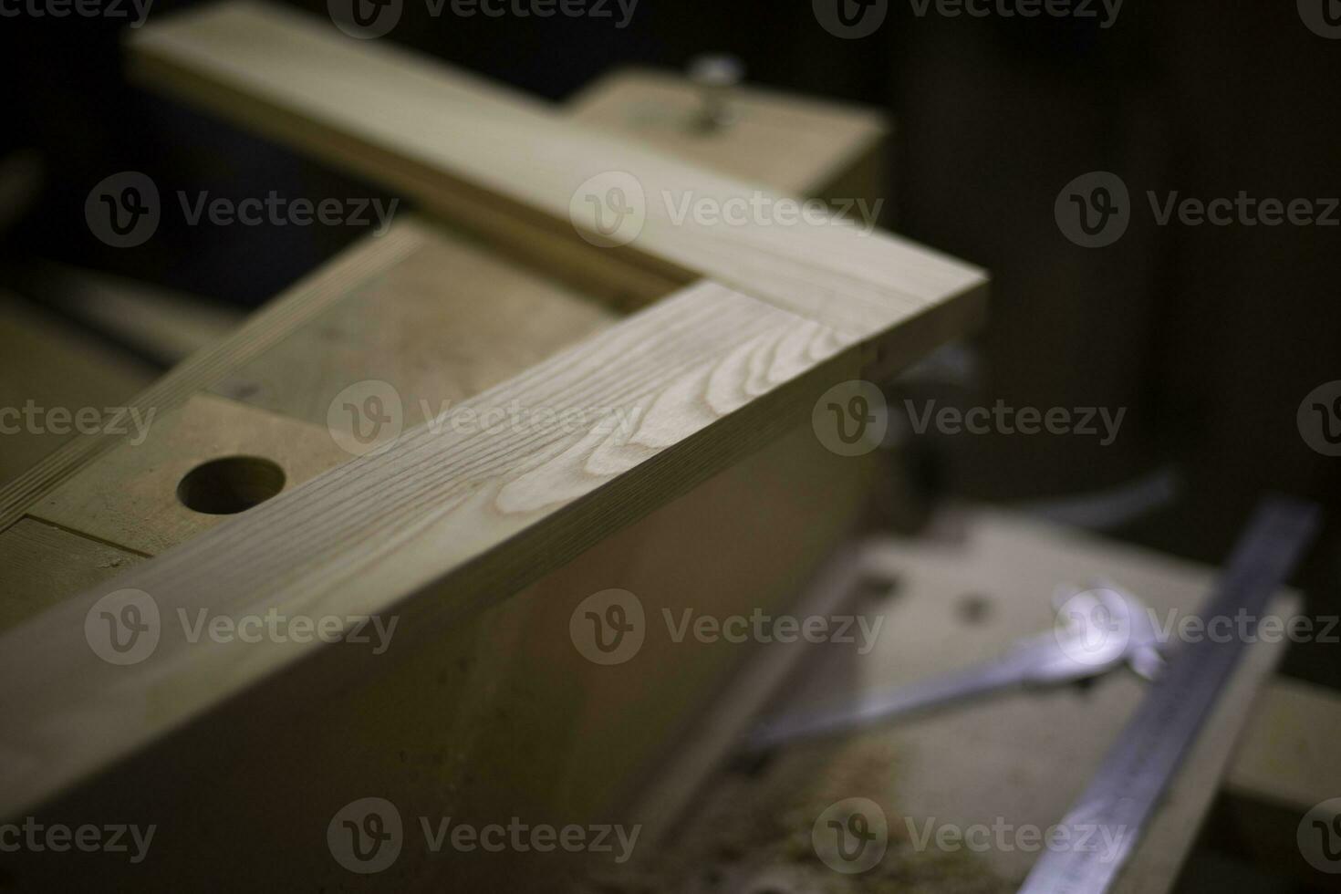 Manufacture of furniture in carpentry workshop. Board without processing. photo