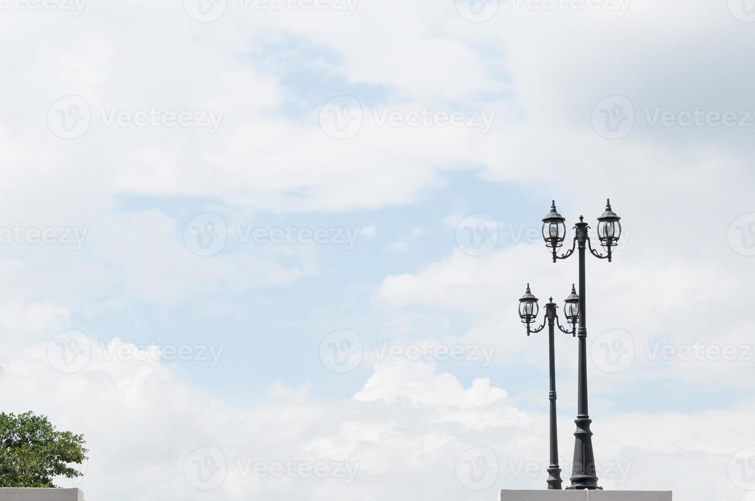 Street lamp retro on blue sky background photo