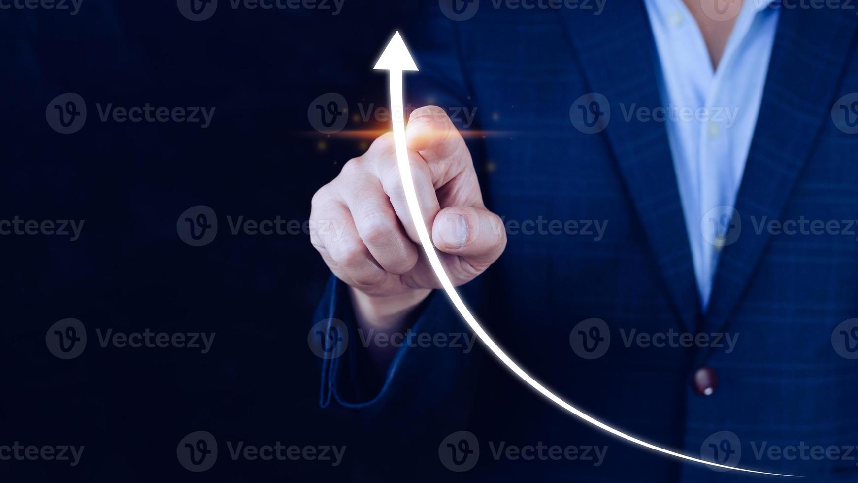 Businessman pointing touching growth on up arrow chart icon, hands touch the up arrow that represents profit rises, monetary growth photo