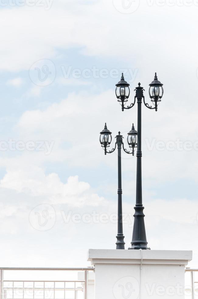 Street lamp retro on blue sky background photo