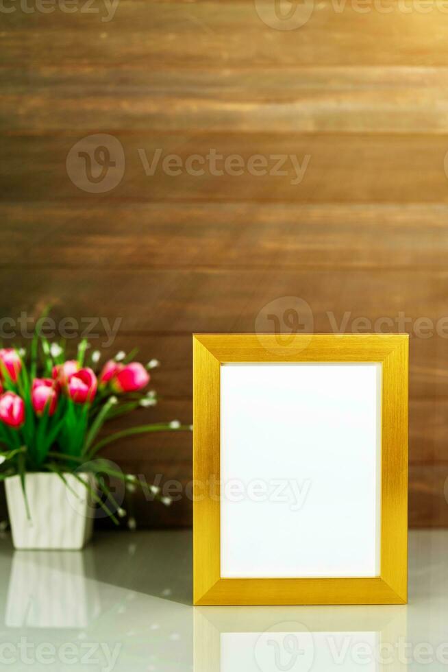 Picture mock up with golden frame on table photo