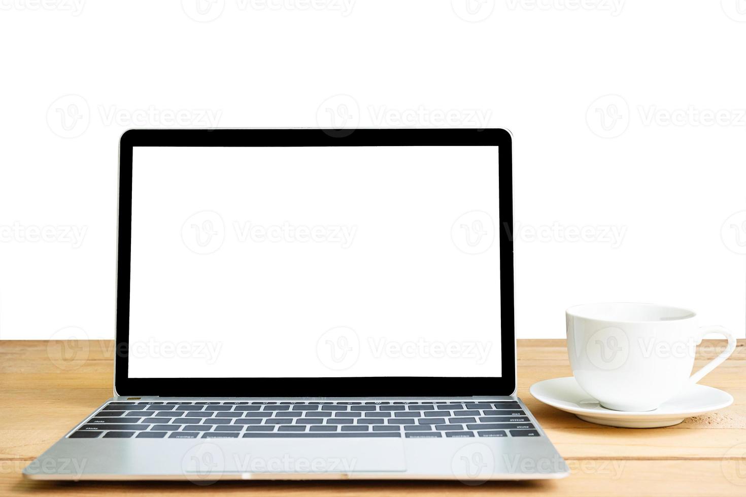 Front view of laptop mockup and coffee cup on white photo