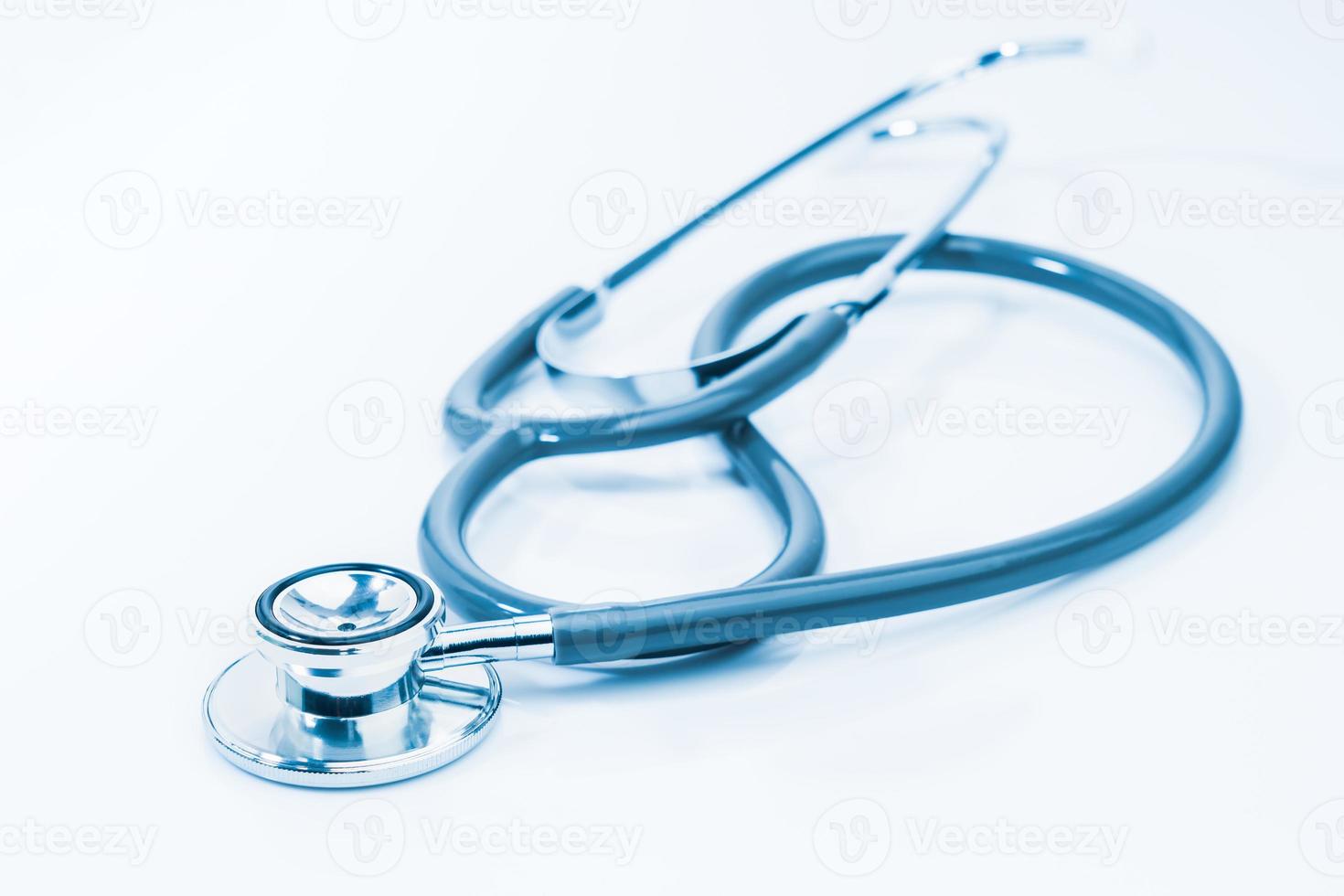 Medical stethoscope for doctor checkup on table photo