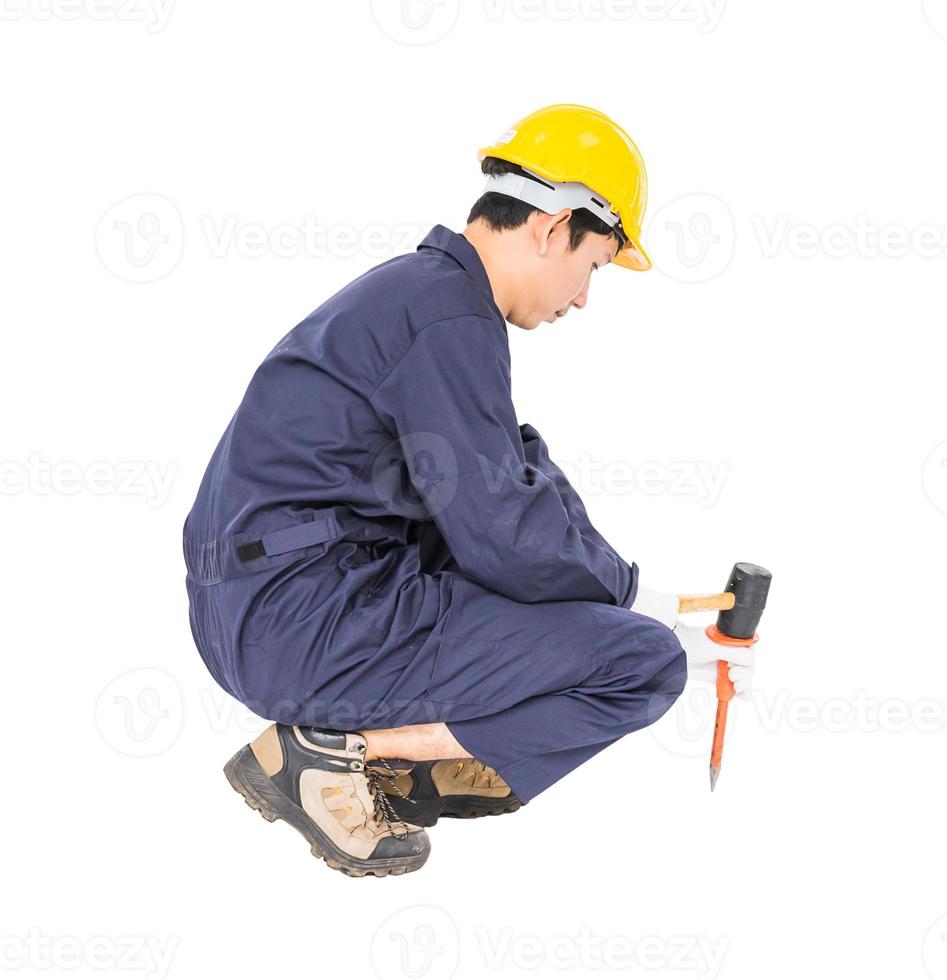 Man hold hammer and cold chisel on white photo
