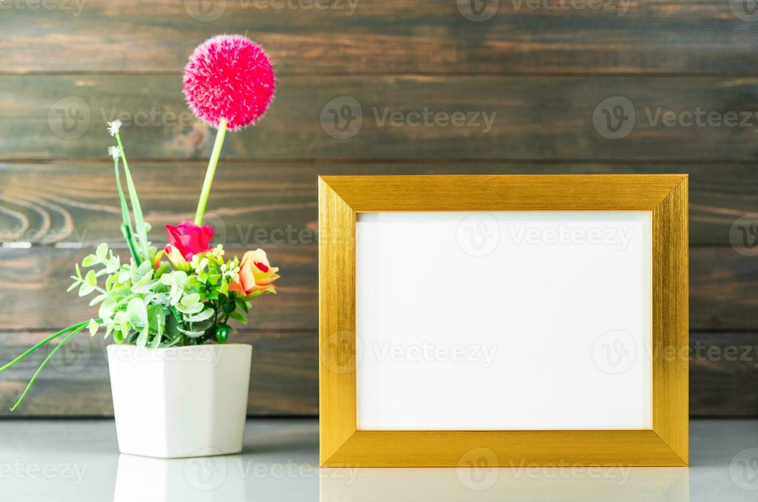 Golden frame and Artificial flower vase bouquet photo