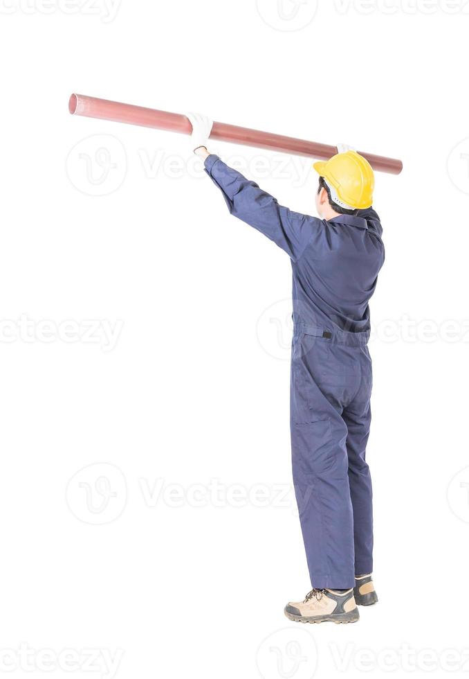 Plumber in uniform holding pvc pipe with clipping path photo