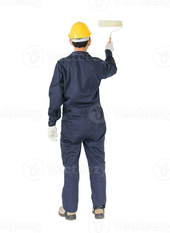 Worker in a uniform using a paint roller is painting invisible floor photo