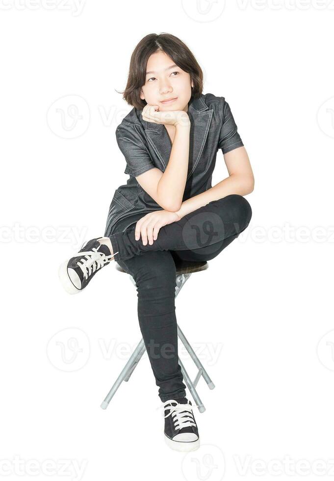 Young women sit on chair over white photo