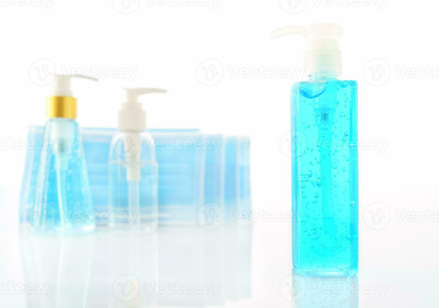 Alcohol gel bottle sanitizer hand and Medical face masks photo
