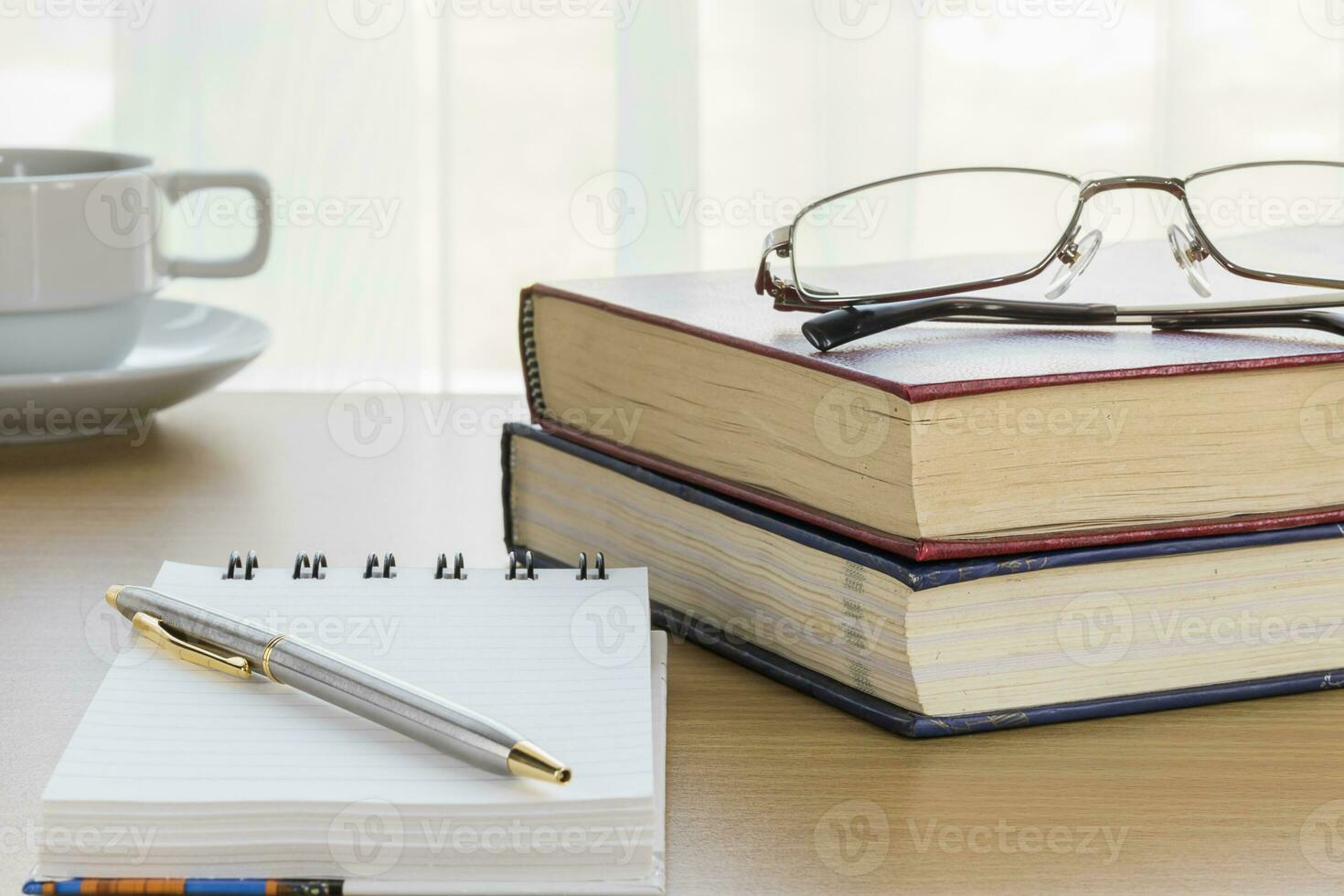 Pen put on notepad open blank page photo