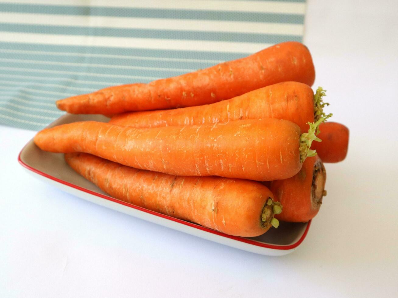 Carrots are biennial plants that store large amounts of carbohydrates for these plants to flower in the second year. photo