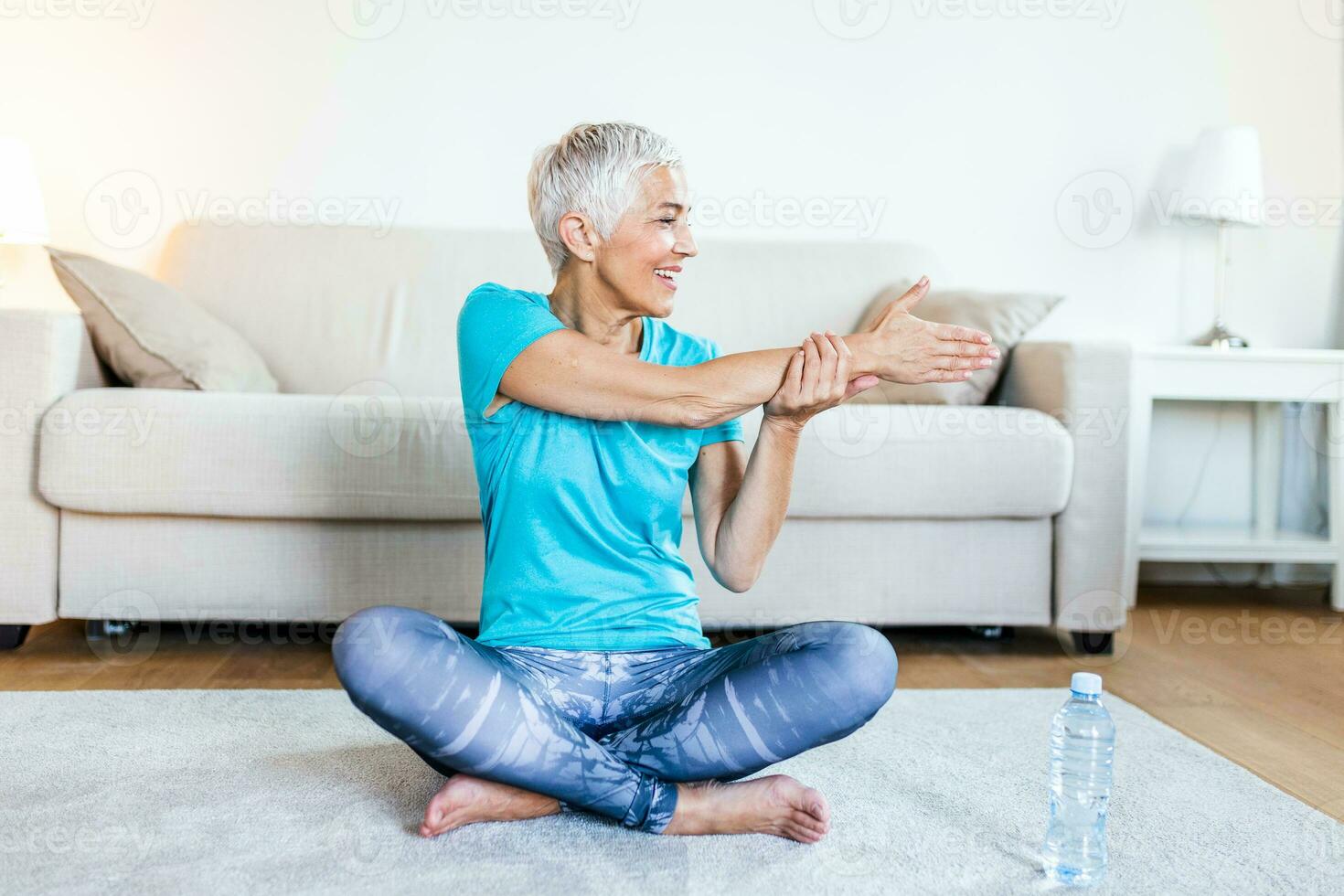 Beautiful Fitness female doing warmup workout at home. Fitness woman doing  stretch exercise stretching her legs,quadriceps . Fit girl living an active  lifestyle. 27783534 Stock Photo at Vecteezy