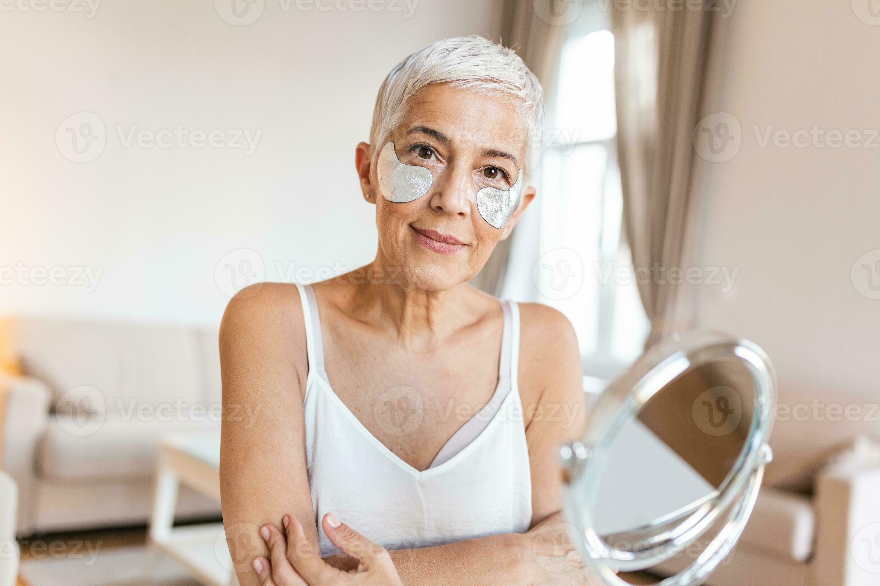Portrait of pretty, nice grandmother with eye patches, having bags