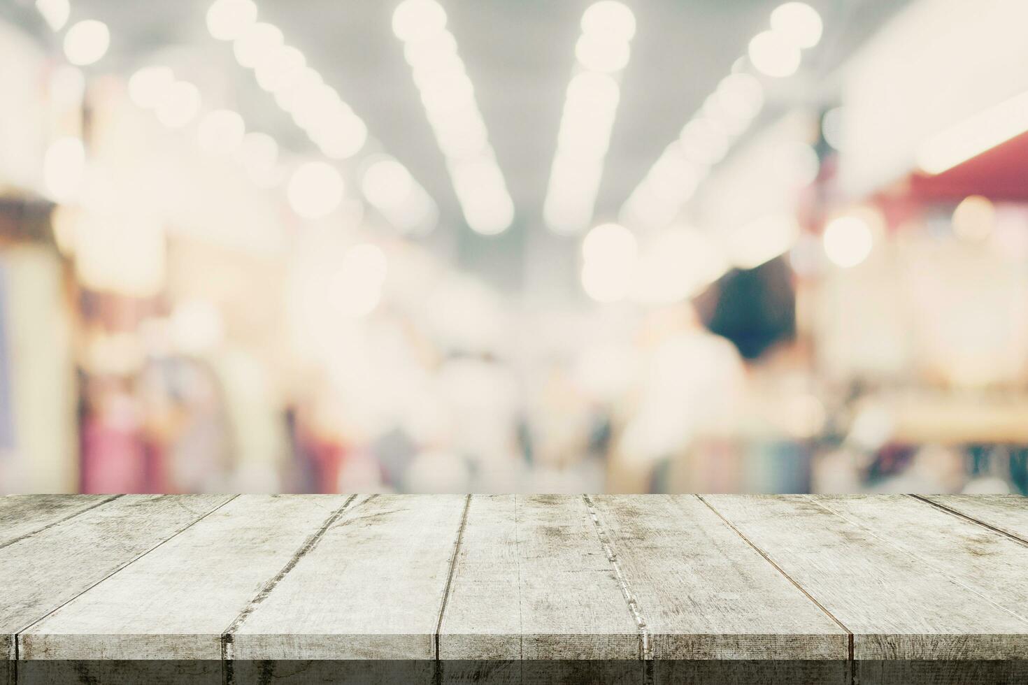 Empty wooden table and Blurred background - Store of shopping mall blur background bokeh with display montage for product. photo