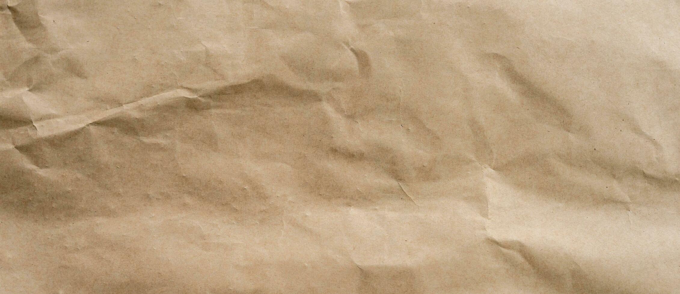 crumpled brown paper background and texture with copy  space. photo