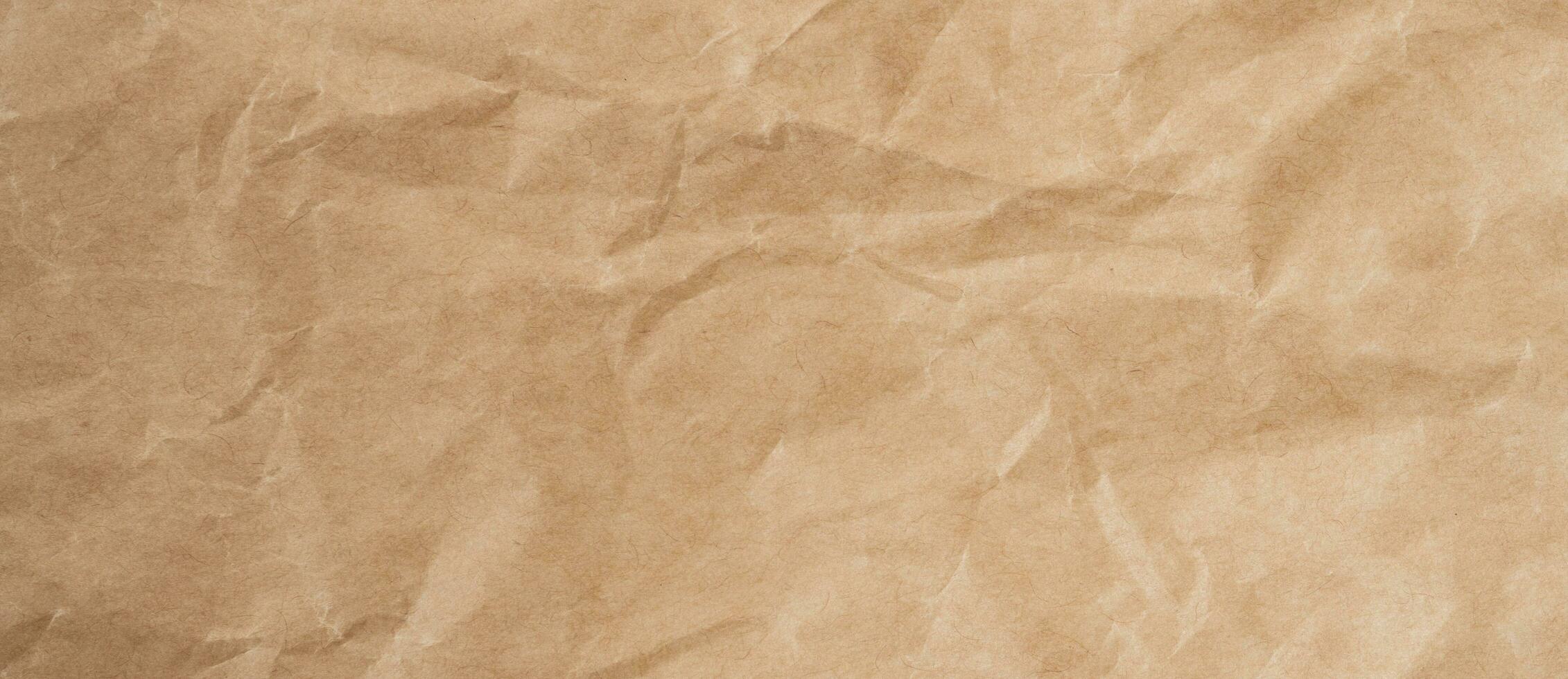 Close up crumpled brown paper texture and background with copy space photo