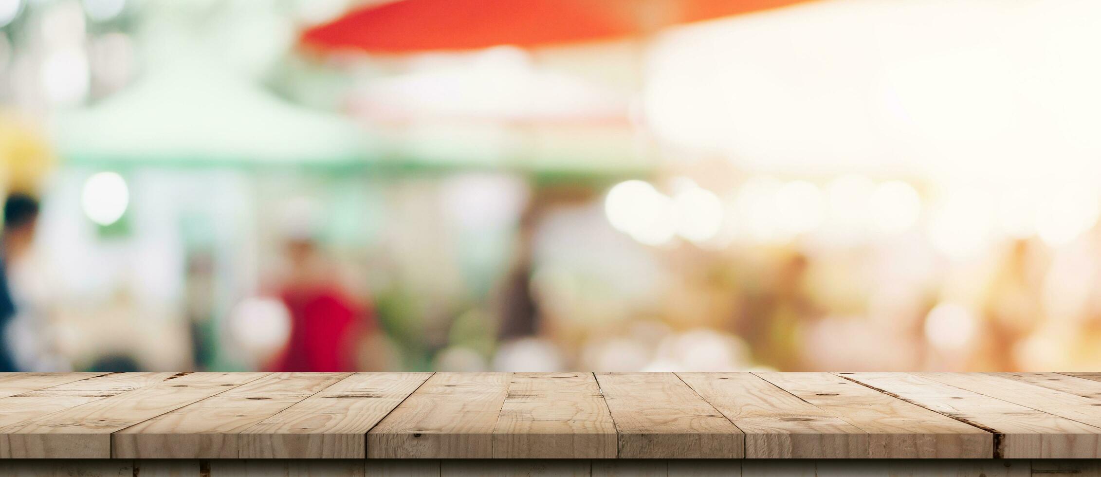 Empty wood table and blurred light table in shopping mall with bokeh background. product display template. photo