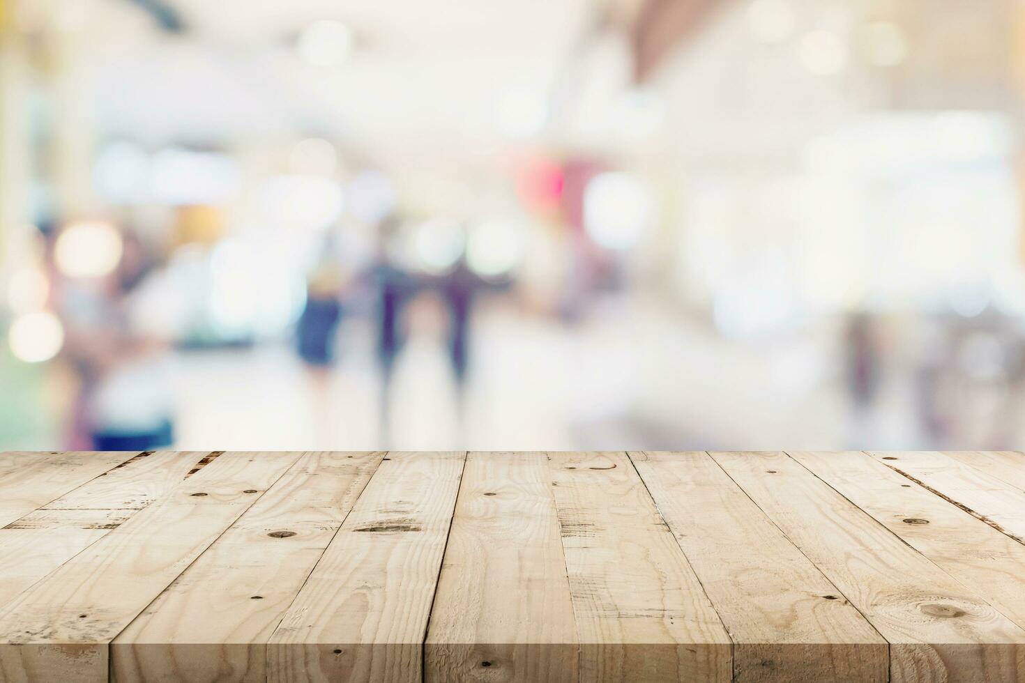 Empty wood table and People in shopping in department store. Defocused blur background, display montage for product with copy space. photo