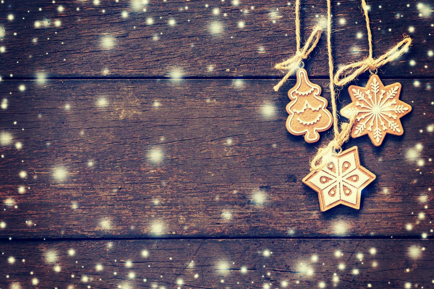 Christmas decoration hanging on snow wood background with copyspace. photo