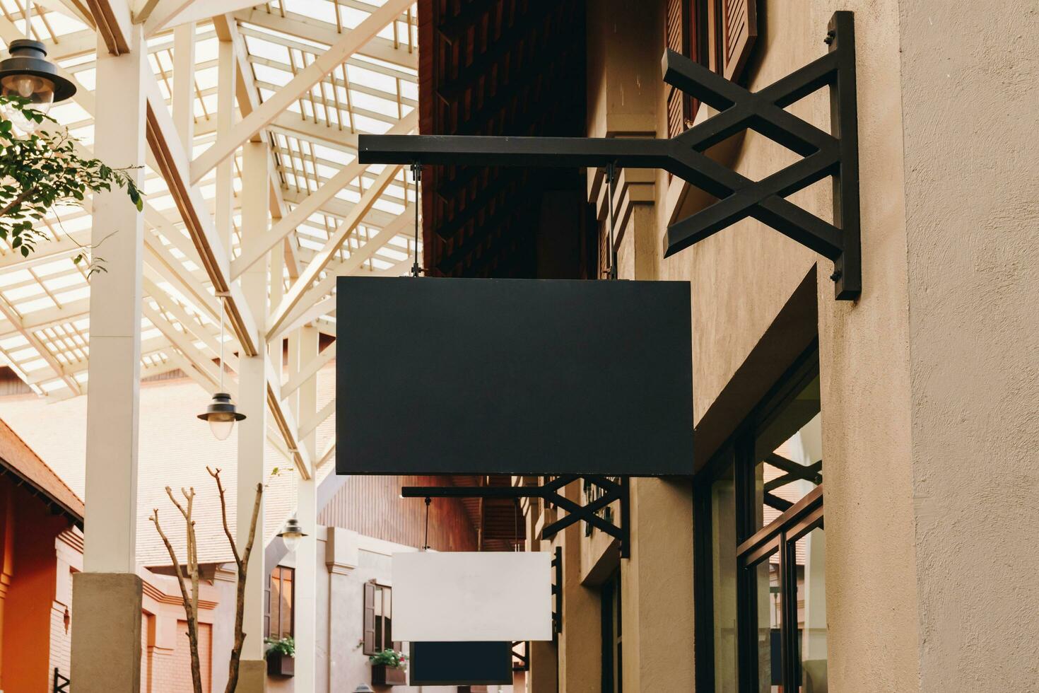 horizontal black empty signage on clothes shop front with copy space. photo