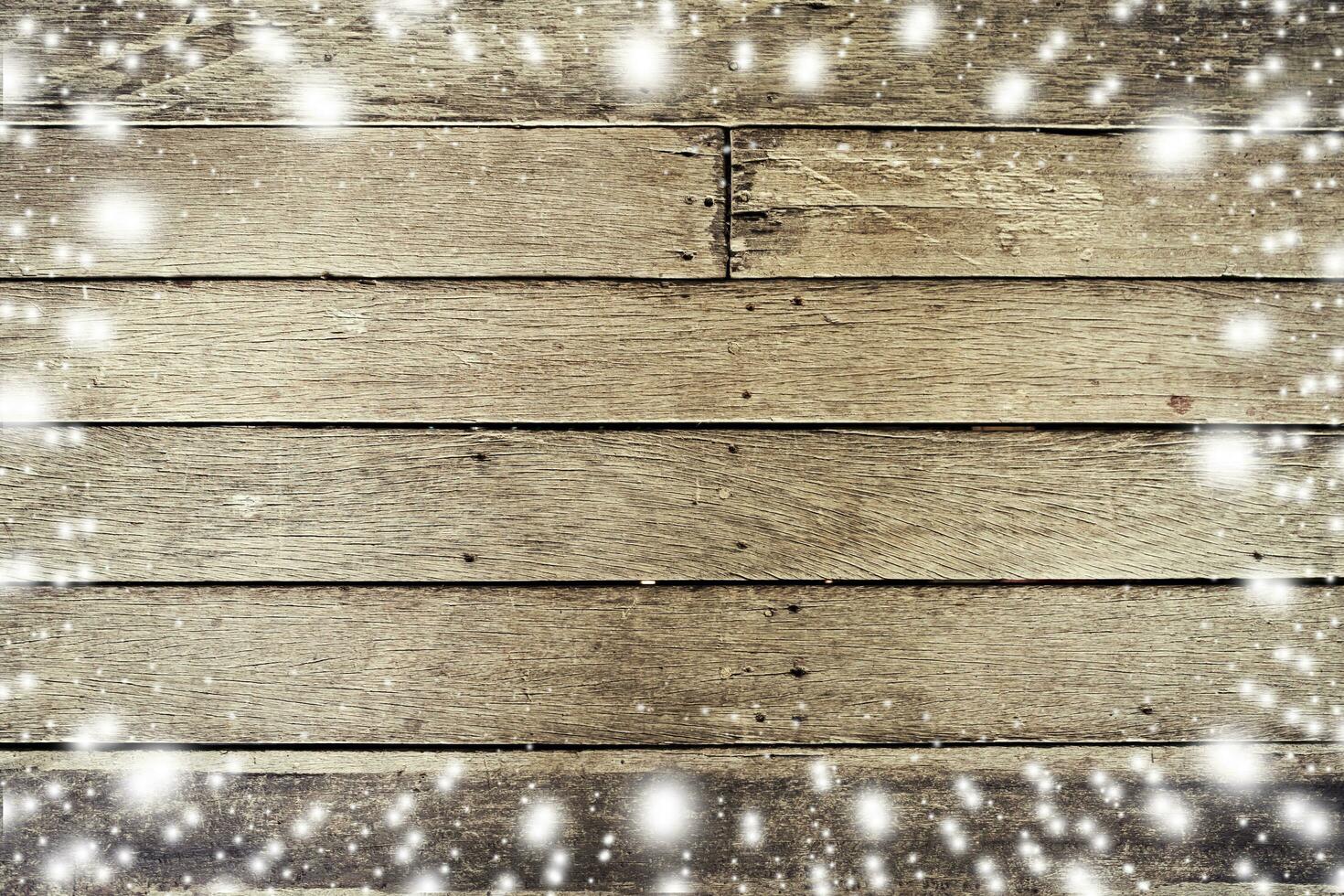 Above snow on wood board background and texture with space for text. photo