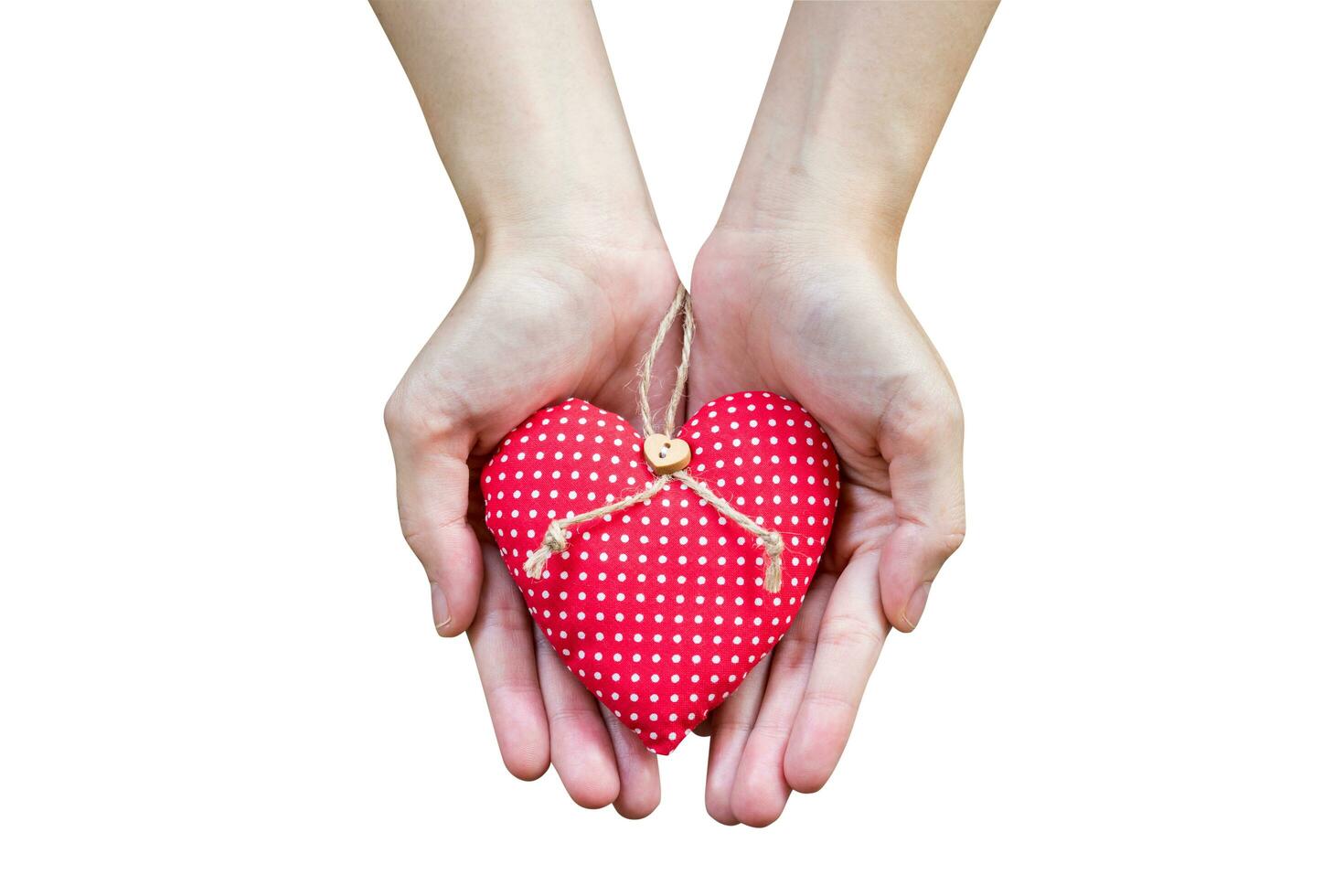 Close up hand woman holding heart on isolate white with clipping path. photo