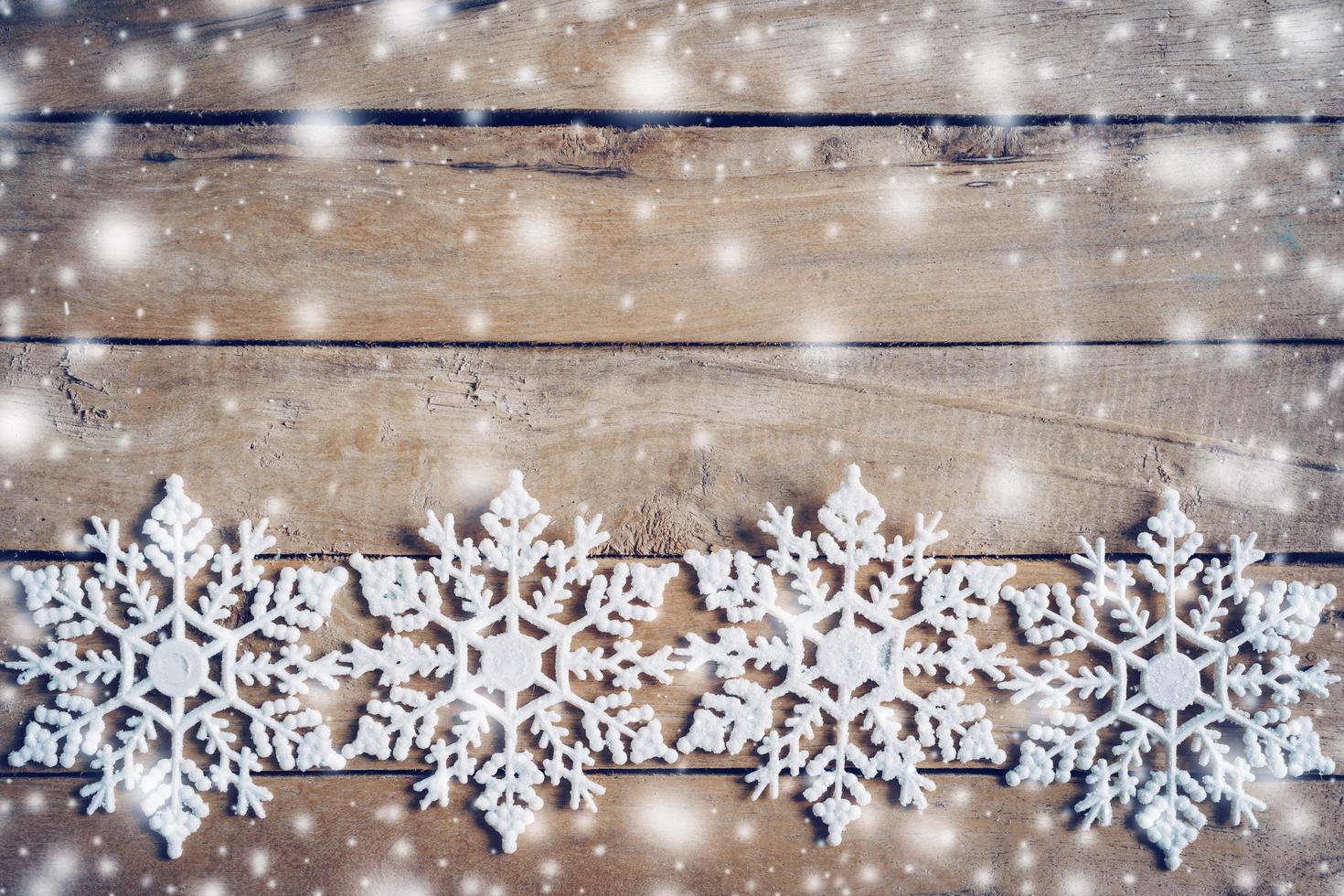 Wooden brown christmas background and snow white with snowflakes, copy space. photo