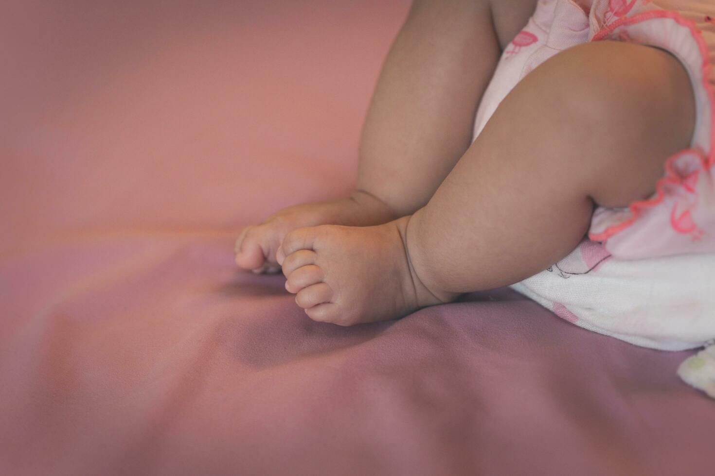 Close up newborn baby leg photo