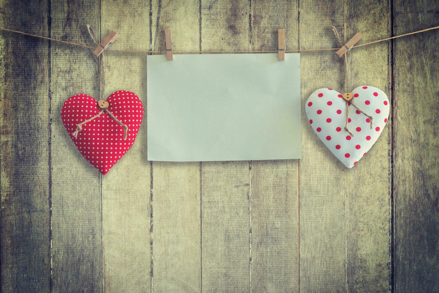 Heart and paper hanging on wood Background and Texture, Vintage toned. photo