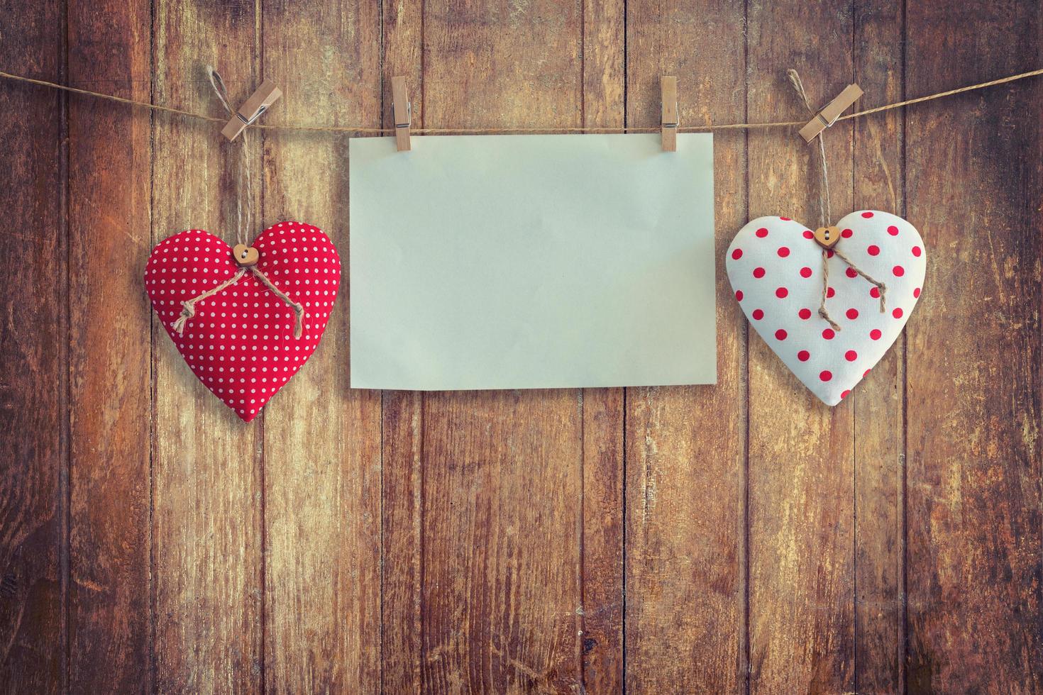 Heart and paper hanging on wood Background and Texture, Vintage toned. photo