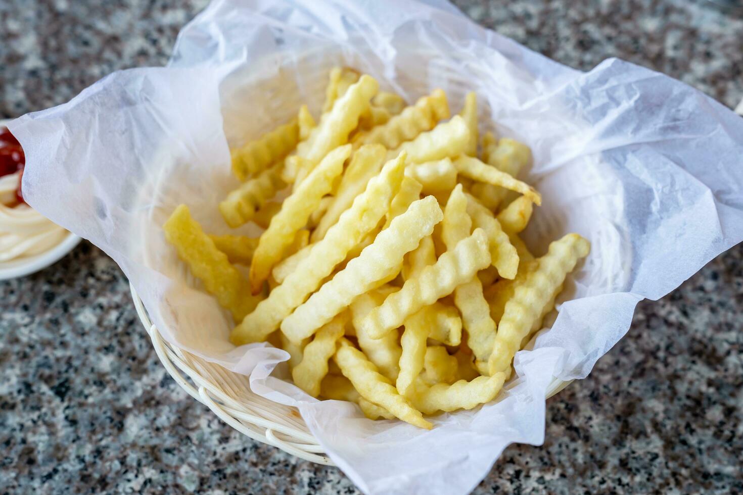 French fries in a basket with ketchup photo