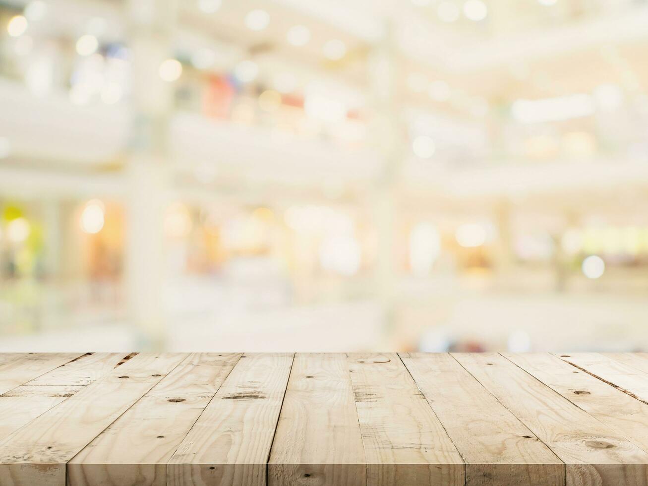 Empty wood table and Blurred background image. supermarket blur background with space display montage for product. photo