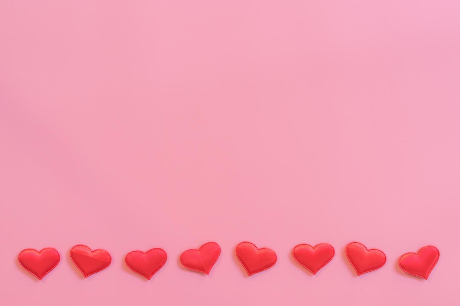Red heart on pink pastel color background with space for text. photo