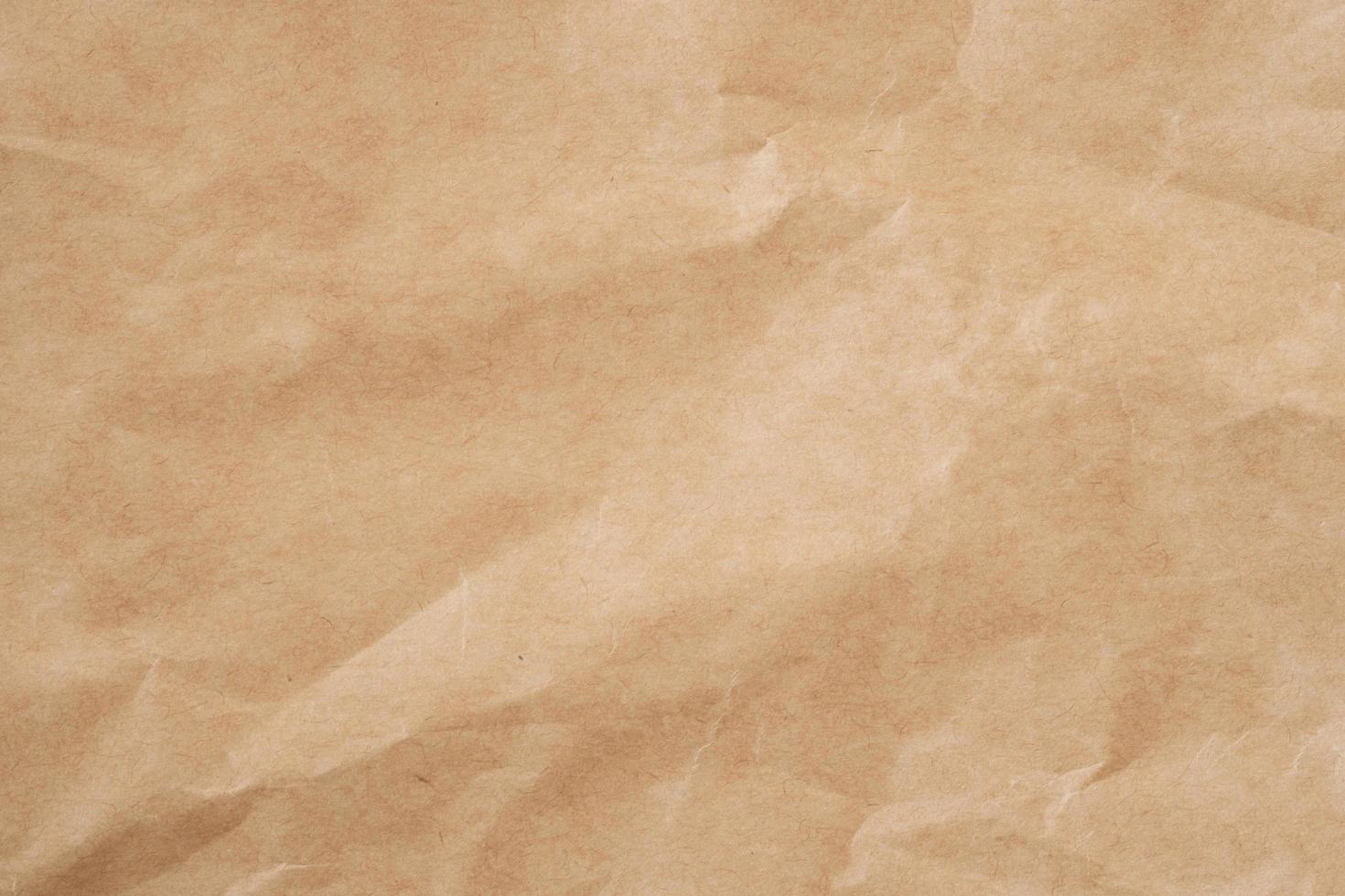 Close up crumpled brown paper texture and background with copy space photo