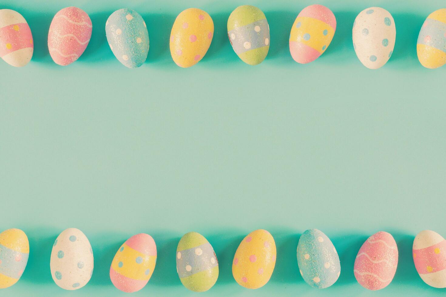 Coloeful easter eggs on pastel color background with space. photo