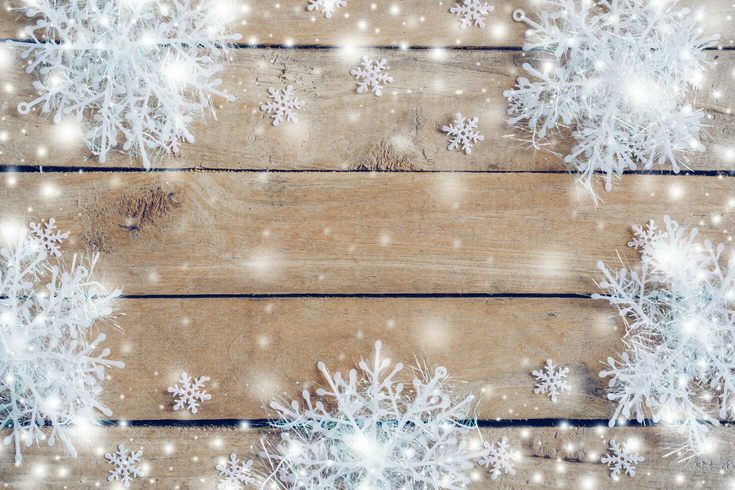 Wooden brown christmas background and snow white with snowflakes, copy space. photo