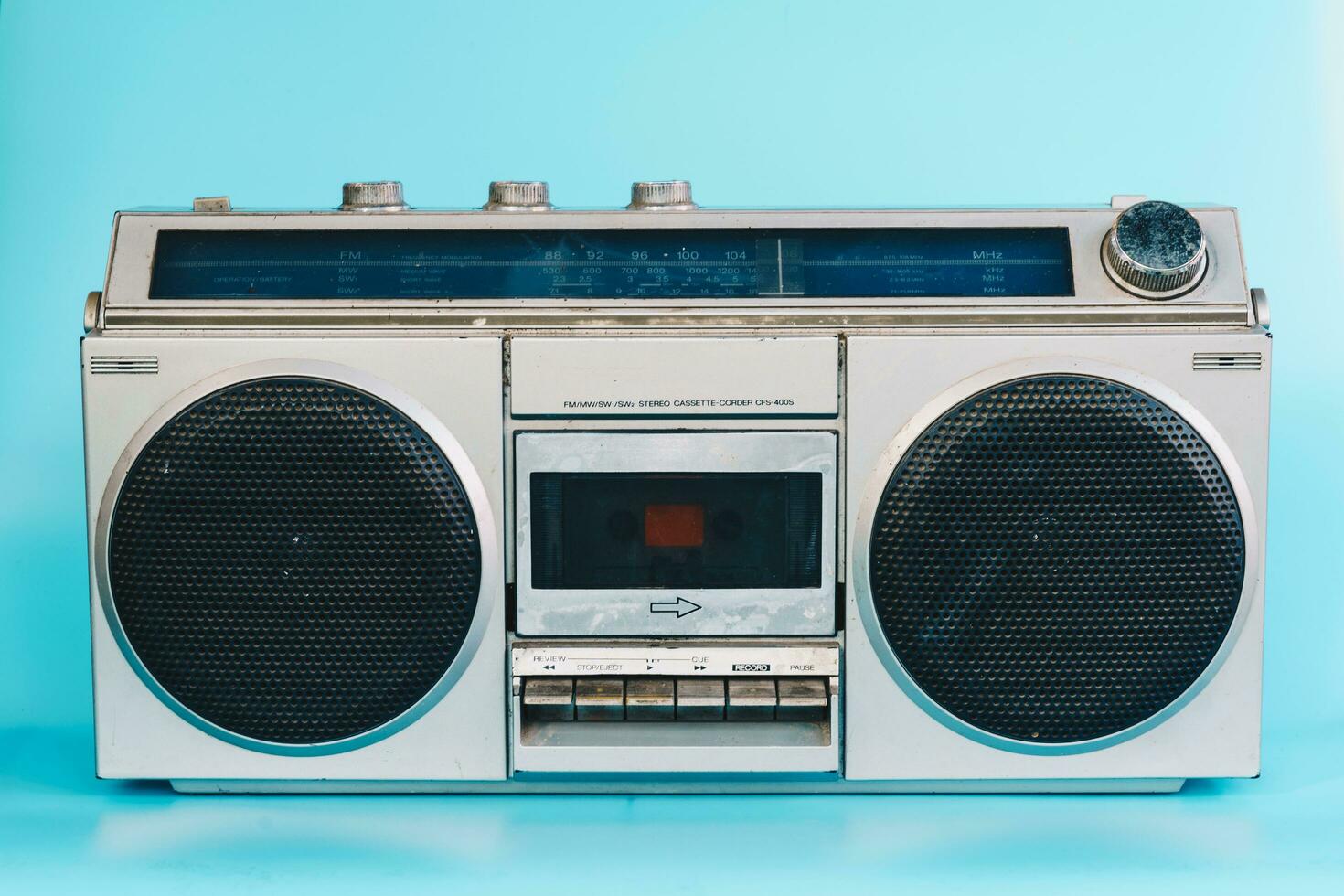 Vintage stereo on blue pastel color background photo