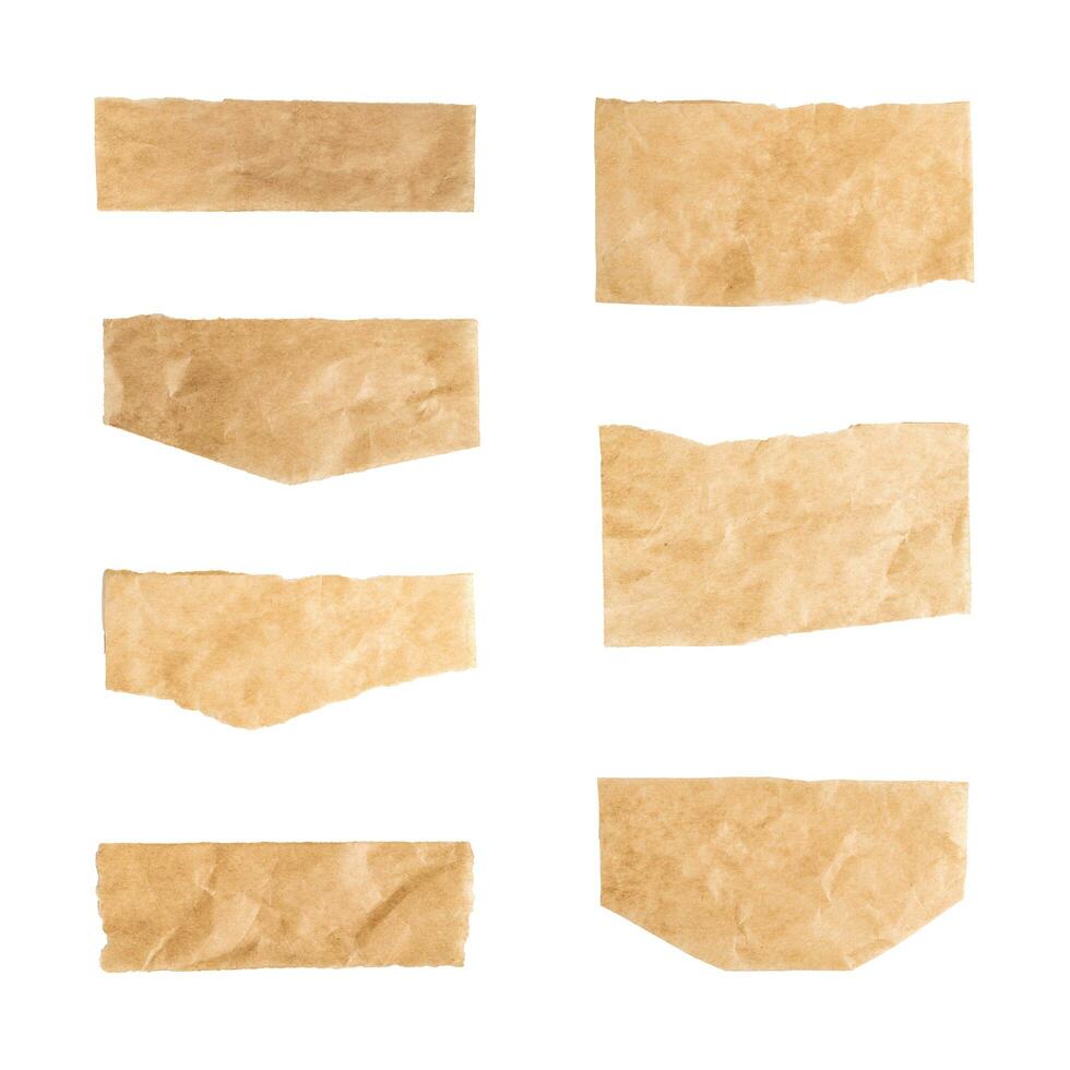 Close up of a ripped piece set of brown paper on white background photo