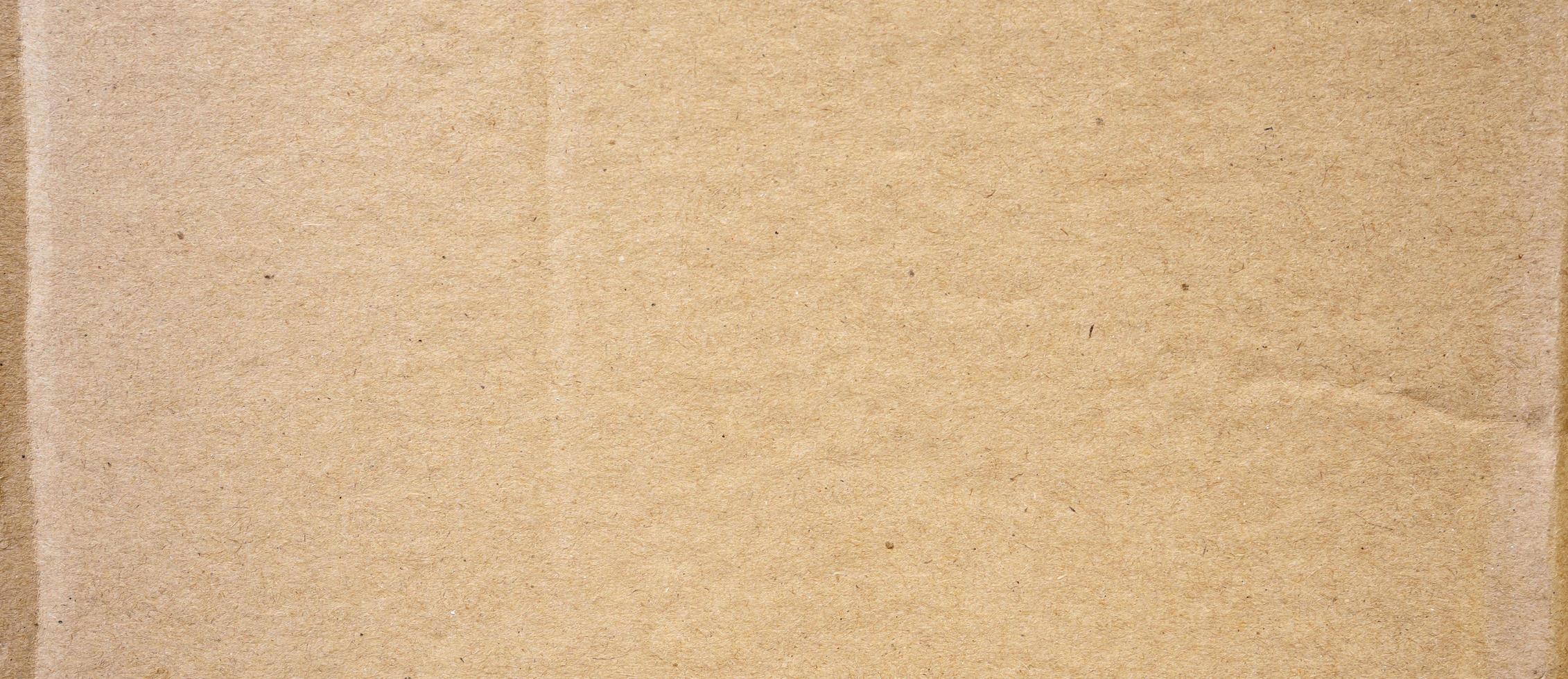 Brown cardboard sheet abstract background. texture of recycle paper box. photo