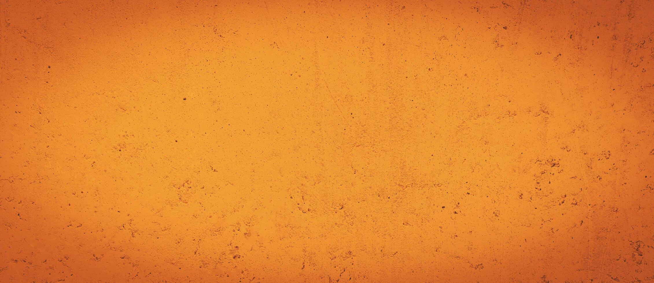 Grunge orange wall concreted wall for interiors texture background. photo