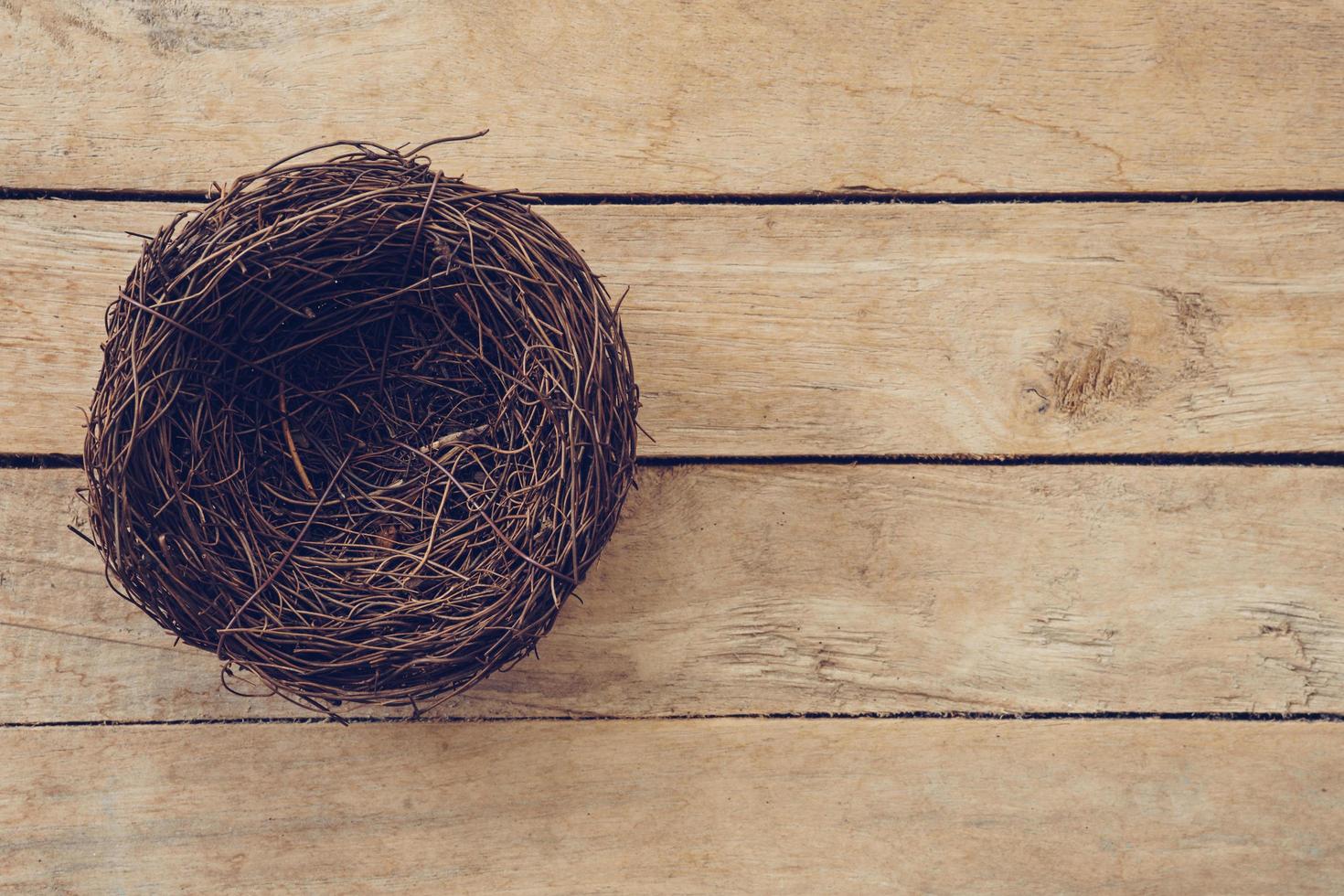 Wood nest on wooden background and texture with copy space. photo