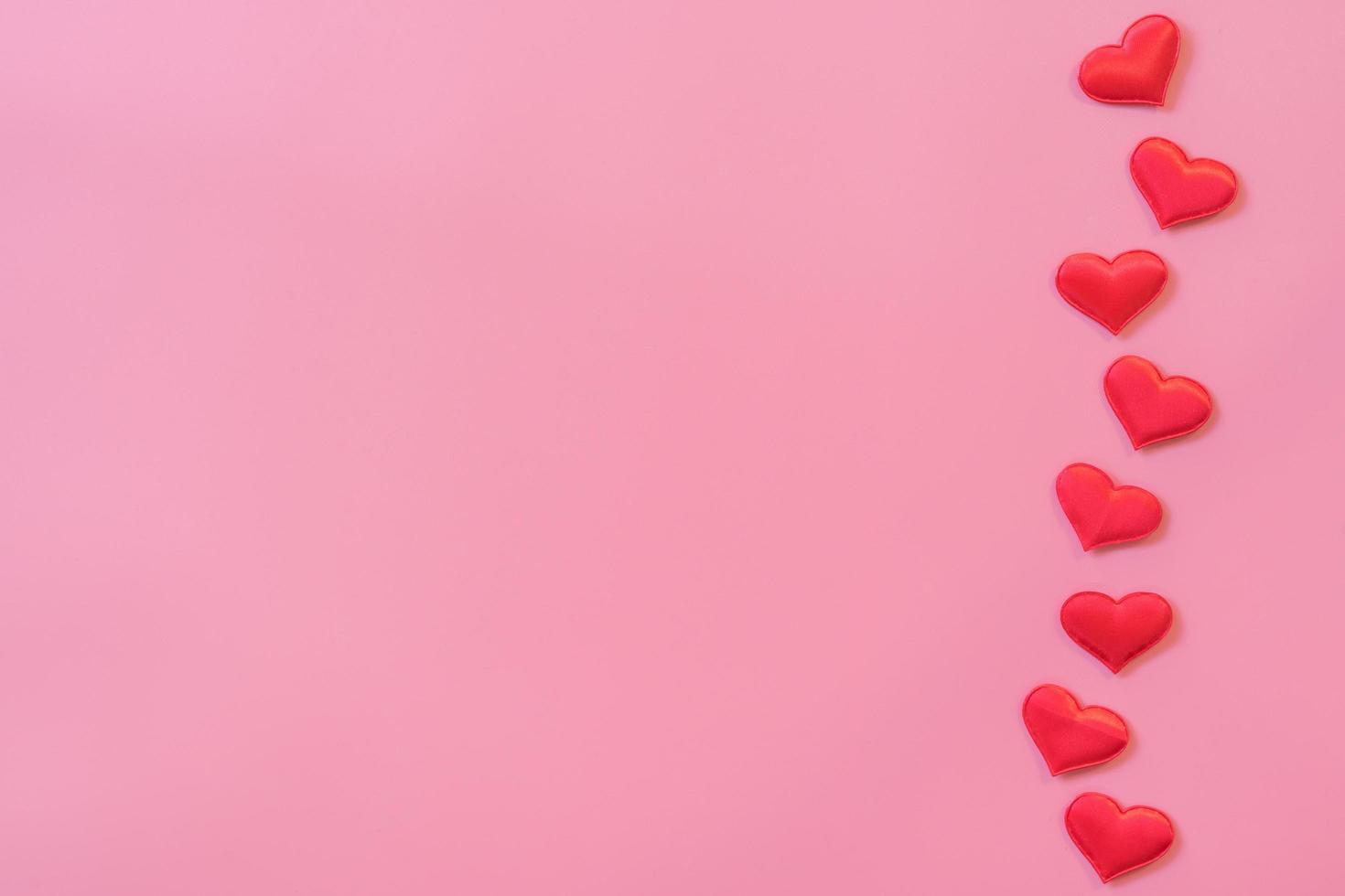 Red heart on pink pastel color background with space for text. photo