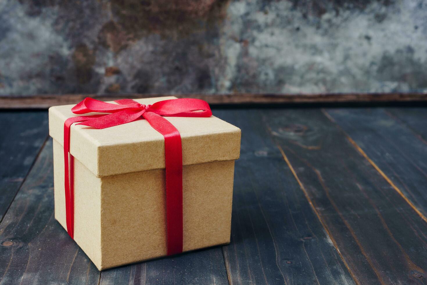 brown gift box on wooden table background with copy space. photo