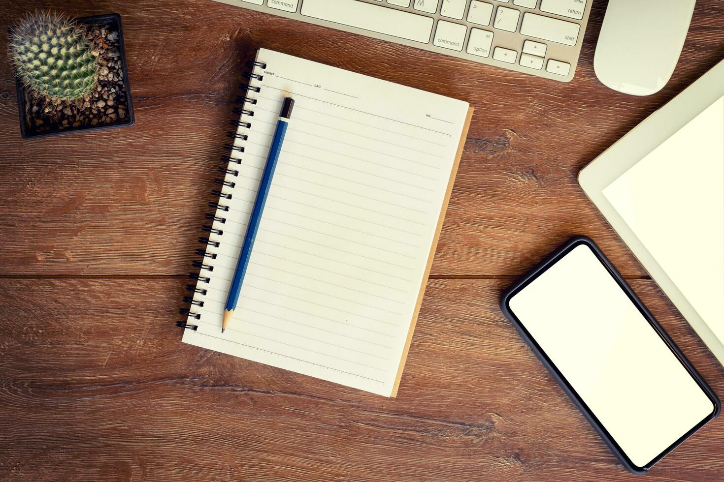 Working place. desktop, notebook, phone and tablet for table setting. photo