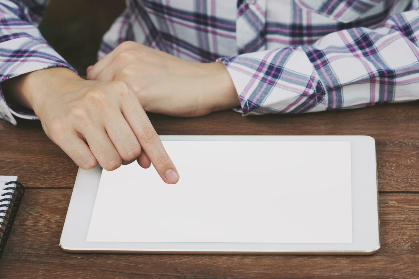 Asia woman using tablet on table in coffee shop photo