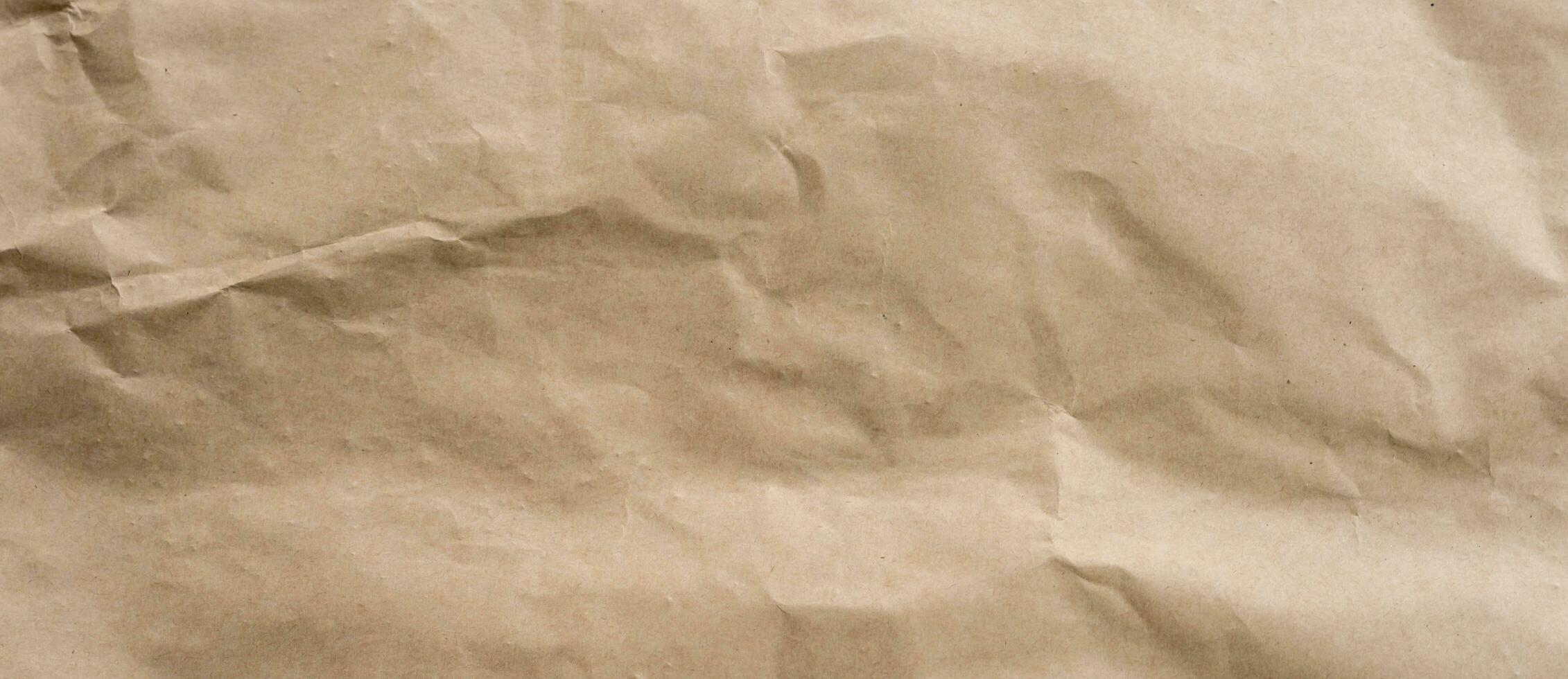 crumpled brown paper background and texture with copy  space. photo