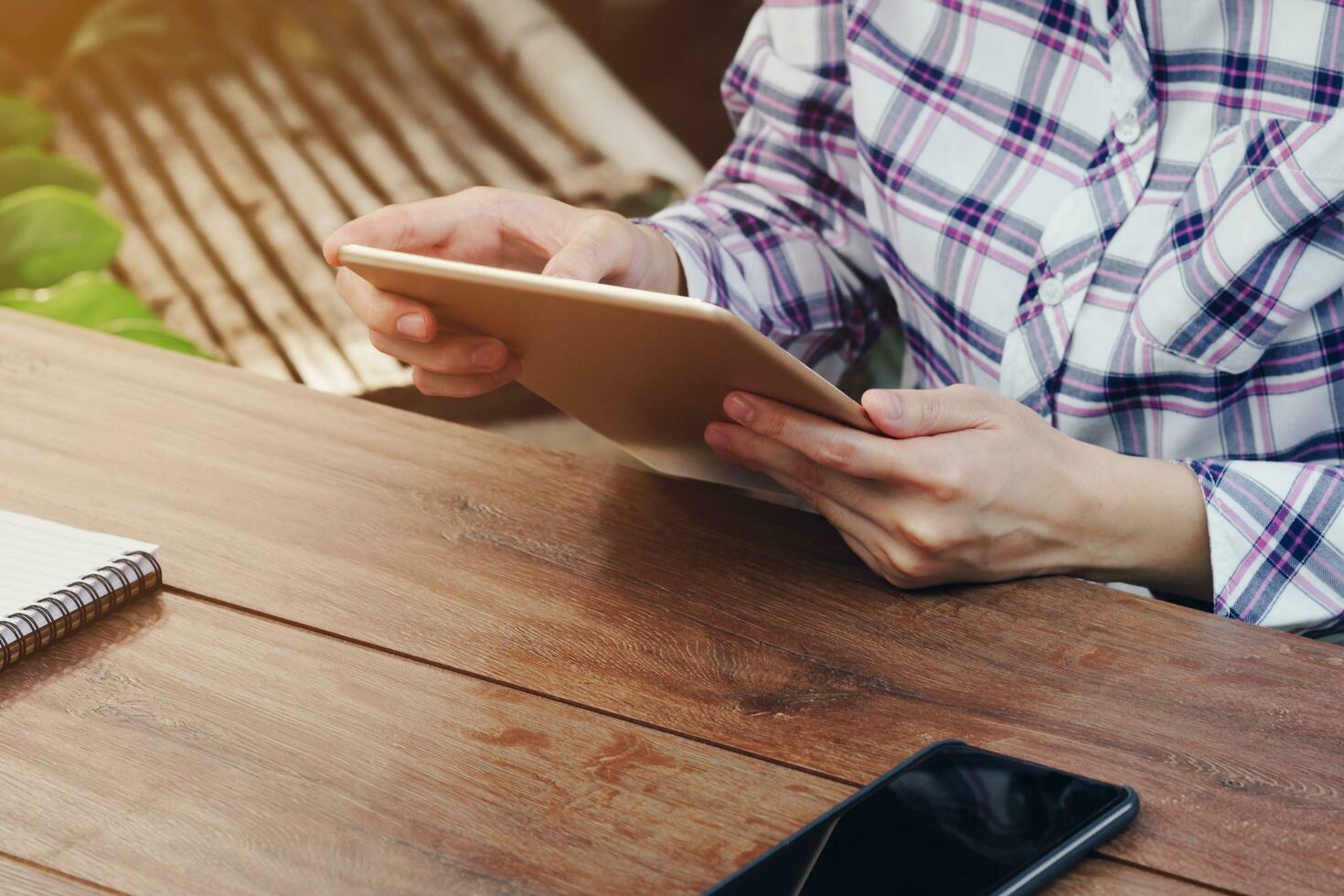 Asia woman using tablet on table in coffee shop photo