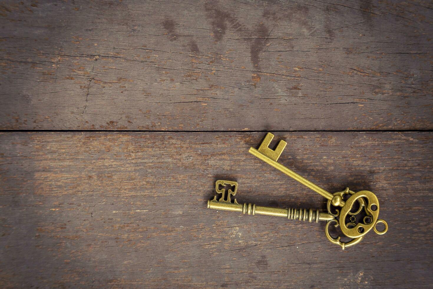 Old key vintage on wood background and texture with space. photo